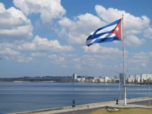 Cuban flag flies over the Malecon in Havana. 